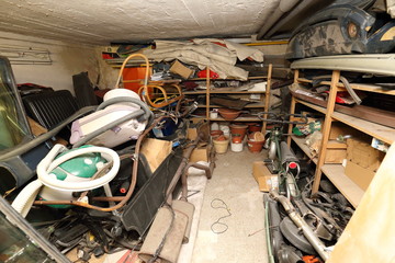 Low cellar full of trash, old vacuum cleaners