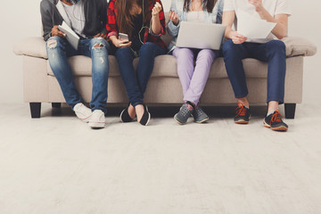 Casual business people working with gadgets indoor