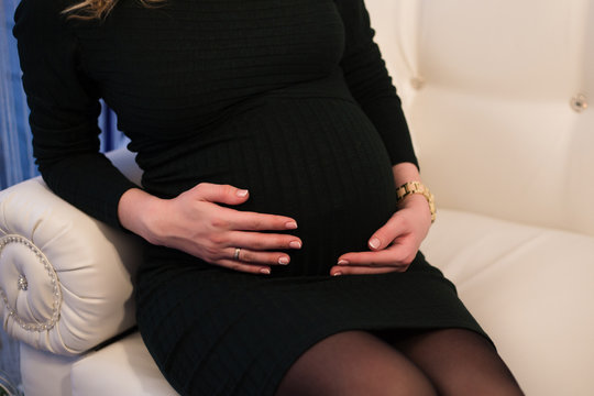 pregnant businesswoman feeling sick at office work