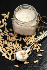 pine nuts pesto sauce over slate