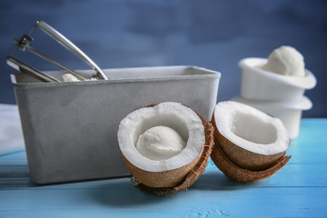 Coconut ice cream and fresh nut on wooden table