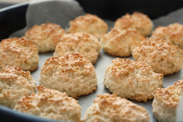 Baking tray with delicious coconut macaroons, closeup