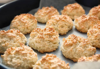 Baking tray with delicious coconut macaroons, closeup
