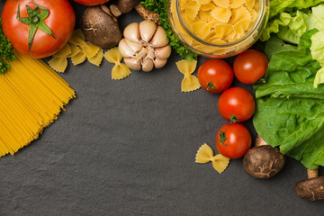 Italian food concept. Pasta ingredients. Cherry-tomatoes, spaghetti pasta, rosemary and spices
