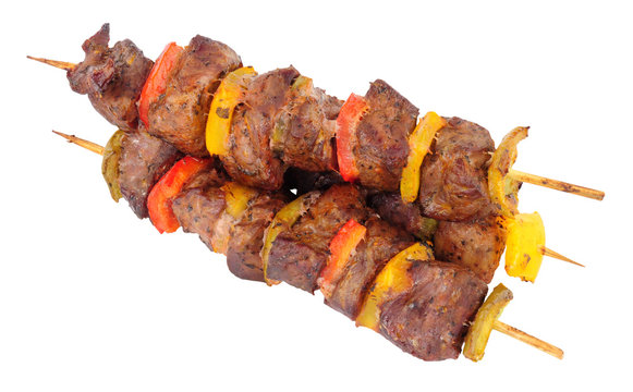 Grilled lamb meat and sweet pepper kebabs isolated on a white background