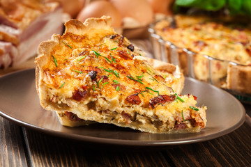 Pieces of quiche lorraine with bacon and cheese