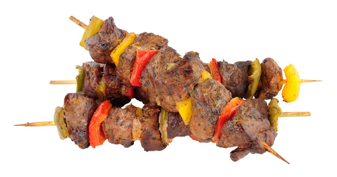 Grilled lamb meat and sweet pepper kebabs isolated on a white background