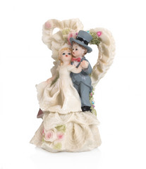 Bride and groom, old cake topper on white background