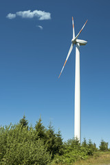 Fototapeta na wymiar Wind turbine against blue sky