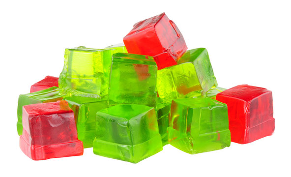 Group of lime and strawberry fruit flavoured jelly cubes isolated on a white background