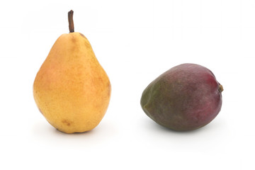 Yellow pear and green mango on a white background. Isolated