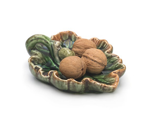 Walnuts on a tray on a white background