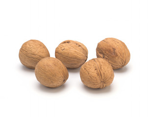 Walnuts in shell on a white background