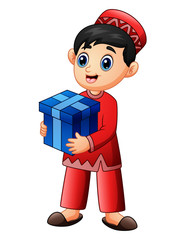 Muslim kid holding red gift box wearing red clothes