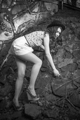 Cute young girl in a black hat. Red-haired girl. Girl In the woods. Black and White.