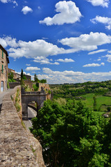 Fototapeta na wymiar Orvieto ancient medieval walls with clouds and Italian countryside