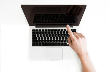 top view of human hand pointing at laptop computer isolated on white, wireless communication concept