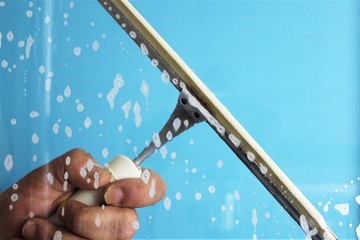 An Image of cleaning a window