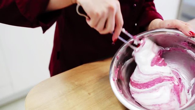 chef cooking macaron batter at confectionery