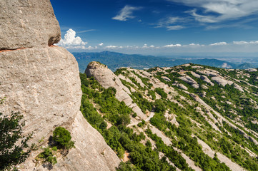 Sunny view of mountains of Santa Maria de Montserrat Abbey in Monistrol de Montserrat, Catalonia,...