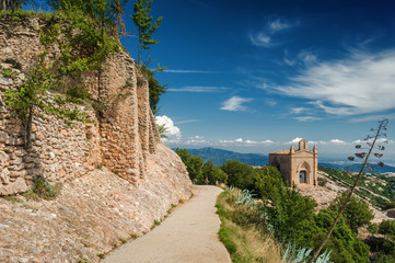 Sunny view of mountains of Santa Maria de Montserrat Abbey in Monistrol de Montserrat, Catalonia,...