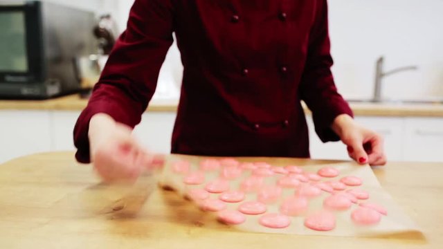 chef with macaron batter at confectionery