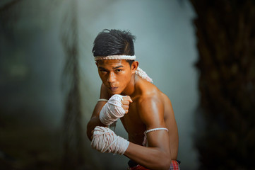 Muay thai, Thai Boxer training in sunset background,Thai boxer is Thailand culture,Thailand