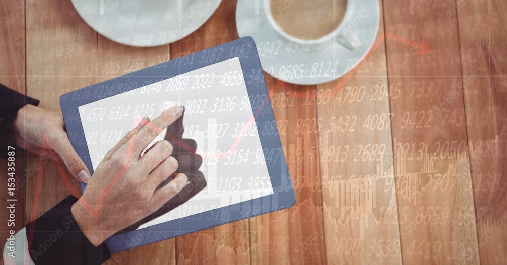 Poster hands using digital tablet at table