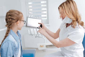 Innovative clever dentist employing technology for education