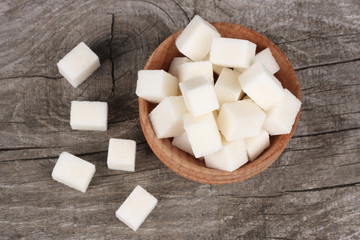 shugar in bowl on old wooden table with copy space. top wiew
