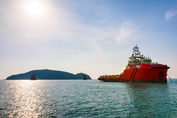 Supply ship waiting to dock in the middle of the sea.