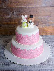 two-tier fondant wedding lace cake with bear and bunny