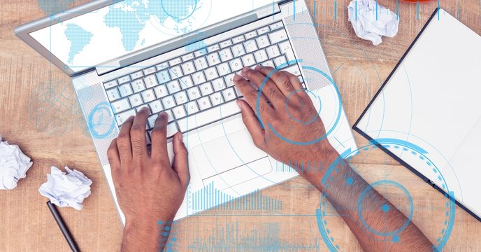 Hands using laptop with overlays