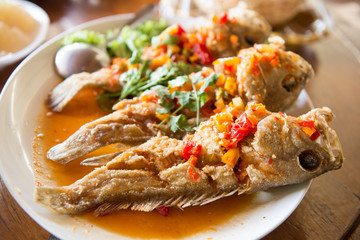 mackerel topped with chili sauce and coconut milk