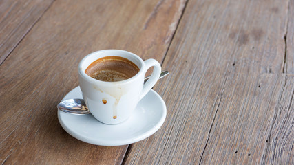 empty coffee cup after drink on a wooden table.