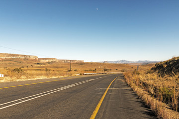 Asphalt Road Running Through Dry Winter Landscape in South Africa