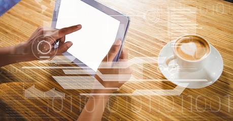 Businessman touching screen of tablet PC by coffee