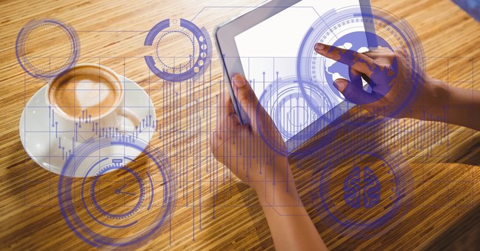 High angle view of hands using tablet PC 