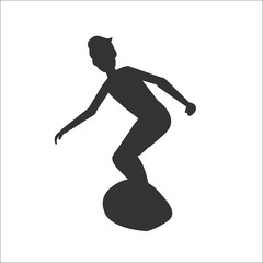 Silhouette of man surfer riding on surfboard