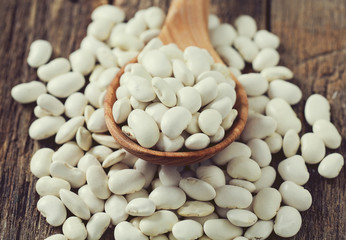 white butter beans on wooden surface