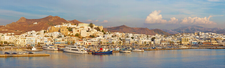 Fototapeta na wymiar CHORA, GREECE - OCTOBER 7, 2015: The panorama of town Chora (Hora) on the Naxos island at evening light in the Aegean Sea.