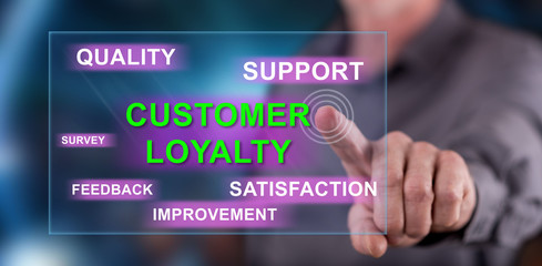 Man touching a customer loyalty concept on a touch screen