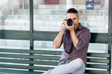 Male photographer taking picture