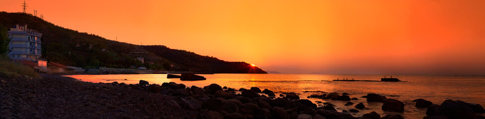 Sunrise panorama on the South coast of Crimea in warm colors