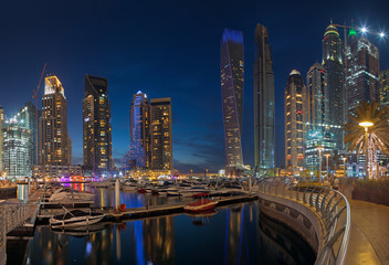 Naklejka na ściany i meble DUBAI, UAE - MARCH 25, 2017: The evening Marina towers.