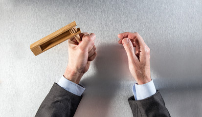 businessman hands holding traditional noisemaker for religious celebration or communication