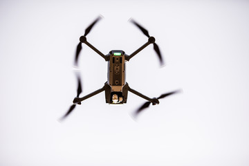 Quadrocopters with camera during flight in the sky