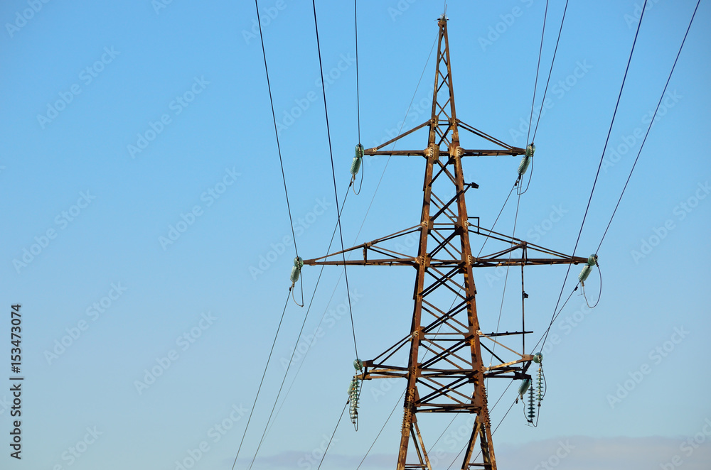 Wall mural electrical transmission pylon. high voltage. blue sky background.