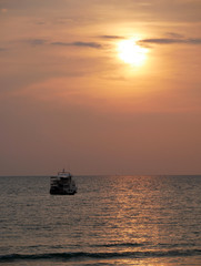 Fototapeta na wymiar Boat with sunset on the sea at Lanta island