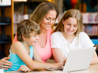Mother with kids in library